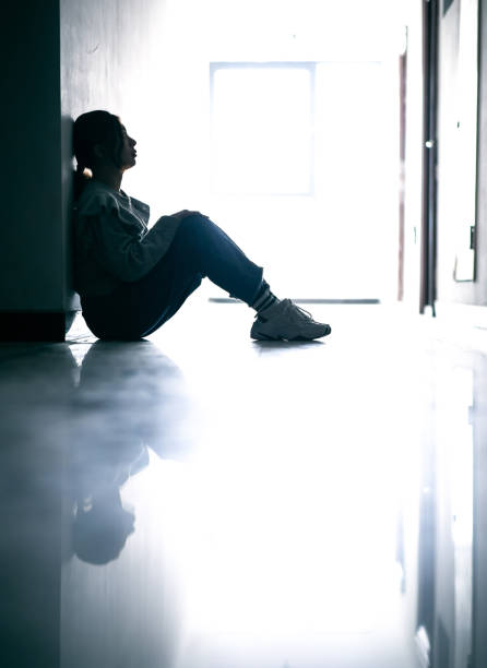sadness teenage girls sitting in tunnel