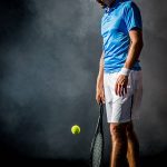 Accueil failure tennis player holding tennis racquet on court.